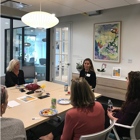 Engaging conversation with coworking colleagues in Sheffield Conference Room at HAYVN in Darien CT